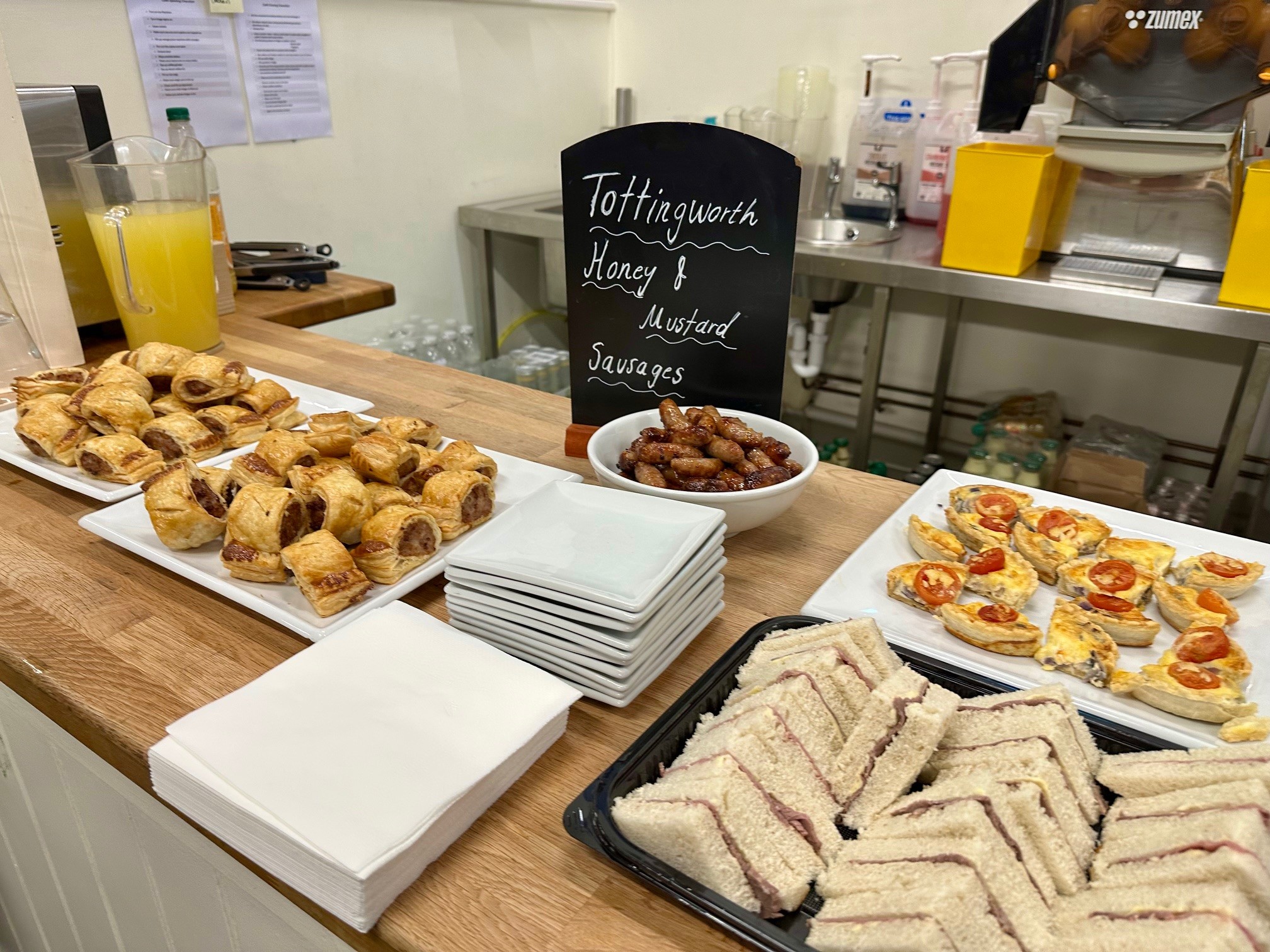 image of food at the Sussex Six event. the photo shows sausage rolls, sandwiches and other baked goods